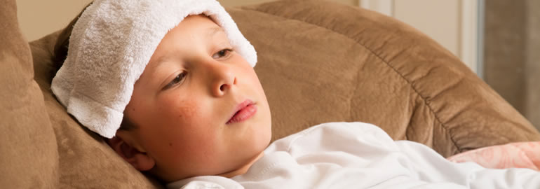 child with cover on forehead