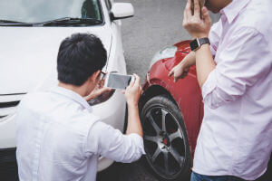 white-and-red-cars-accident-guy-taking-pics