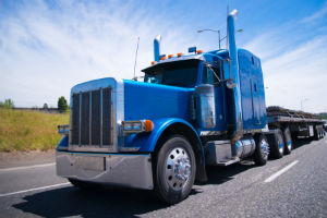 blue semi truck on highway