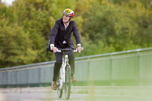 business man riding a bike