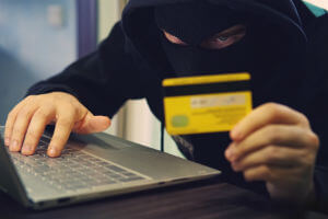 cyber-criminal-mask-credit-card