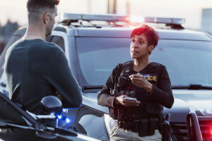 male-witness-talking-to-female-cop