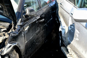 sideswipe crash with two cars