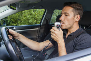 blowing into ignition interlock device