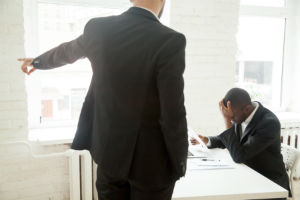 workplace-discrimination-black-man-head-down