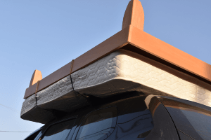 car with a mattress on its roof