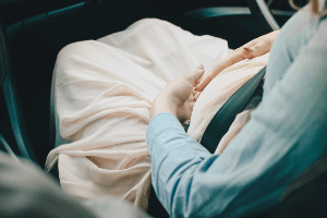 pregnant woman in a car 