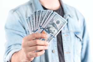 man offering cash