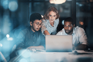 team of employees working overtime 
