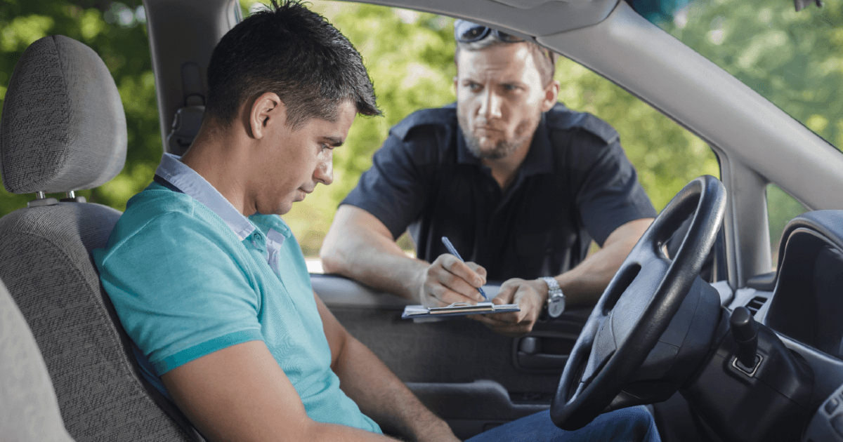 man getting pulled over by a police officer