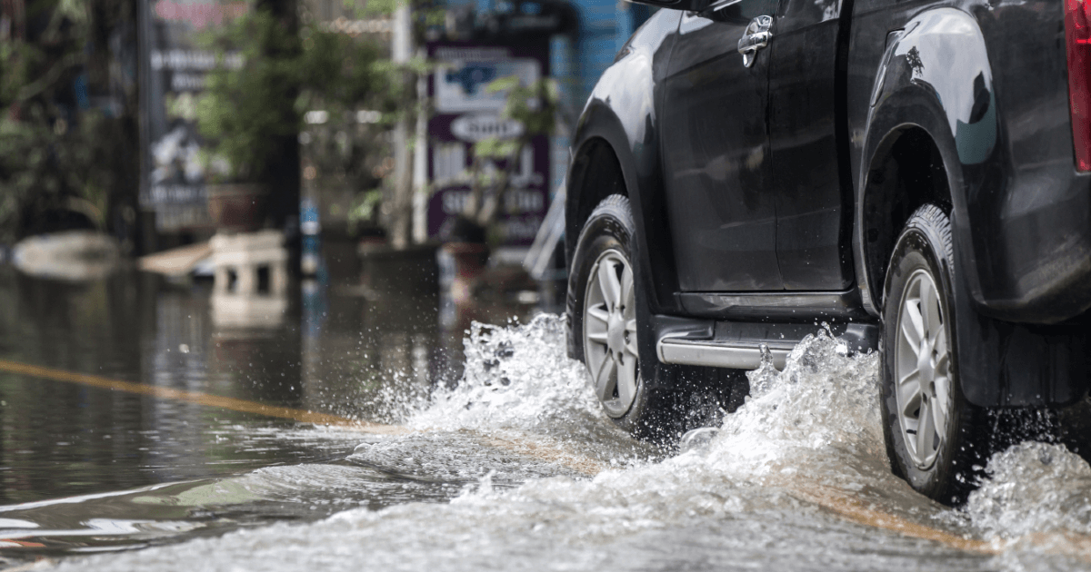 truck driving through flood waters