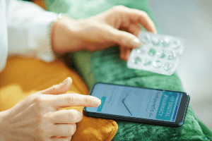 woman placing a prescription drug order on her cellphone