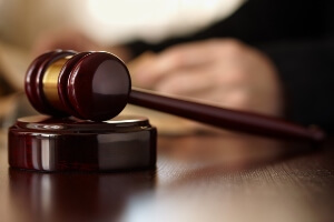 close-up image of a gavel in a courtroom