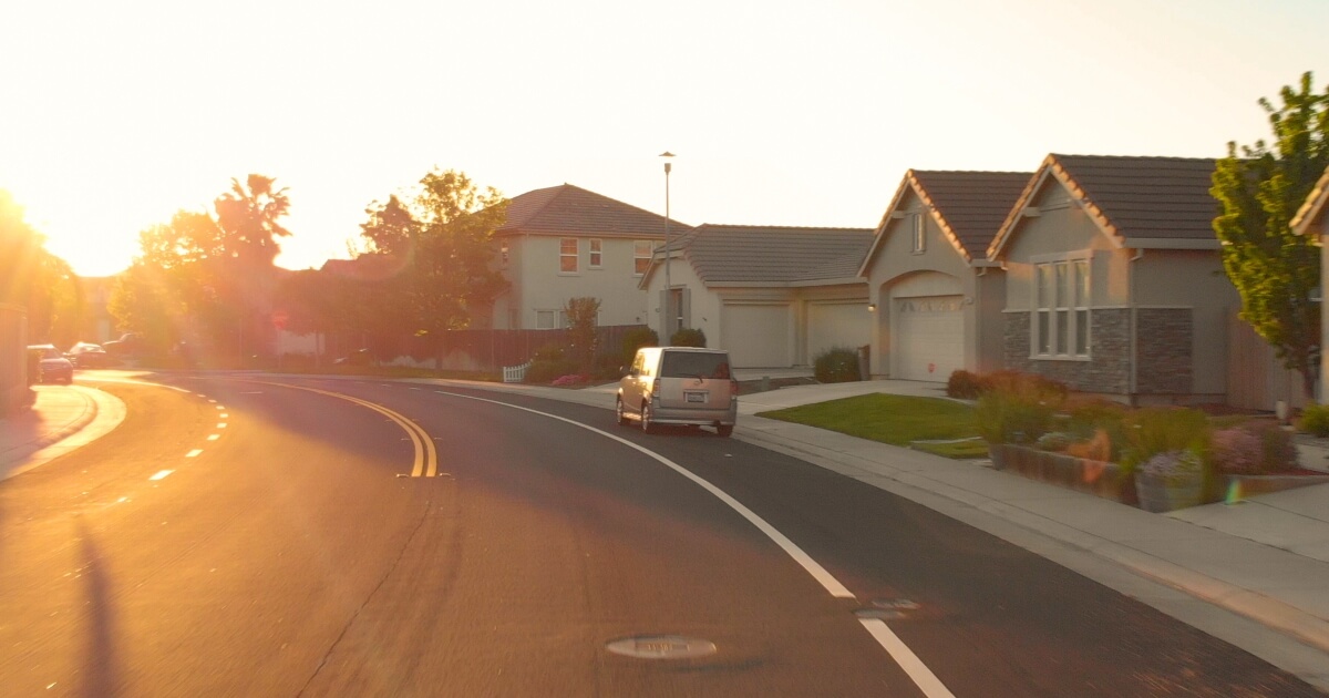 image of neighborhood road at sunset.