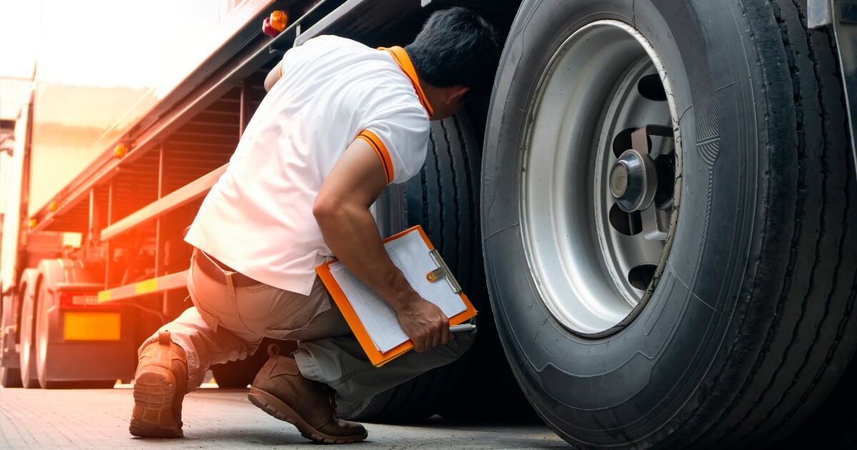 image of a truck being inspected for maintenance