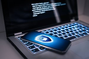 smartphone with laptop and lock icon