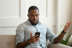 man-with-phone-shocked