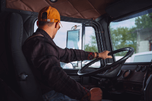 truck driver behind the wheel of a truck